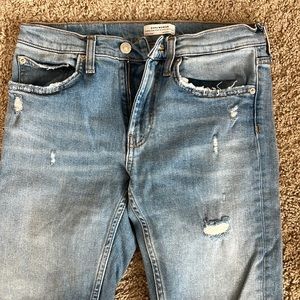 Zara denim jeans with fringe bottom and lettered stitching